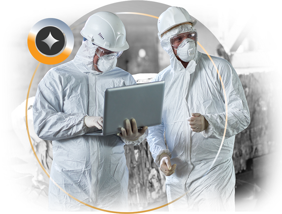 Image of two technicians holding a laptop